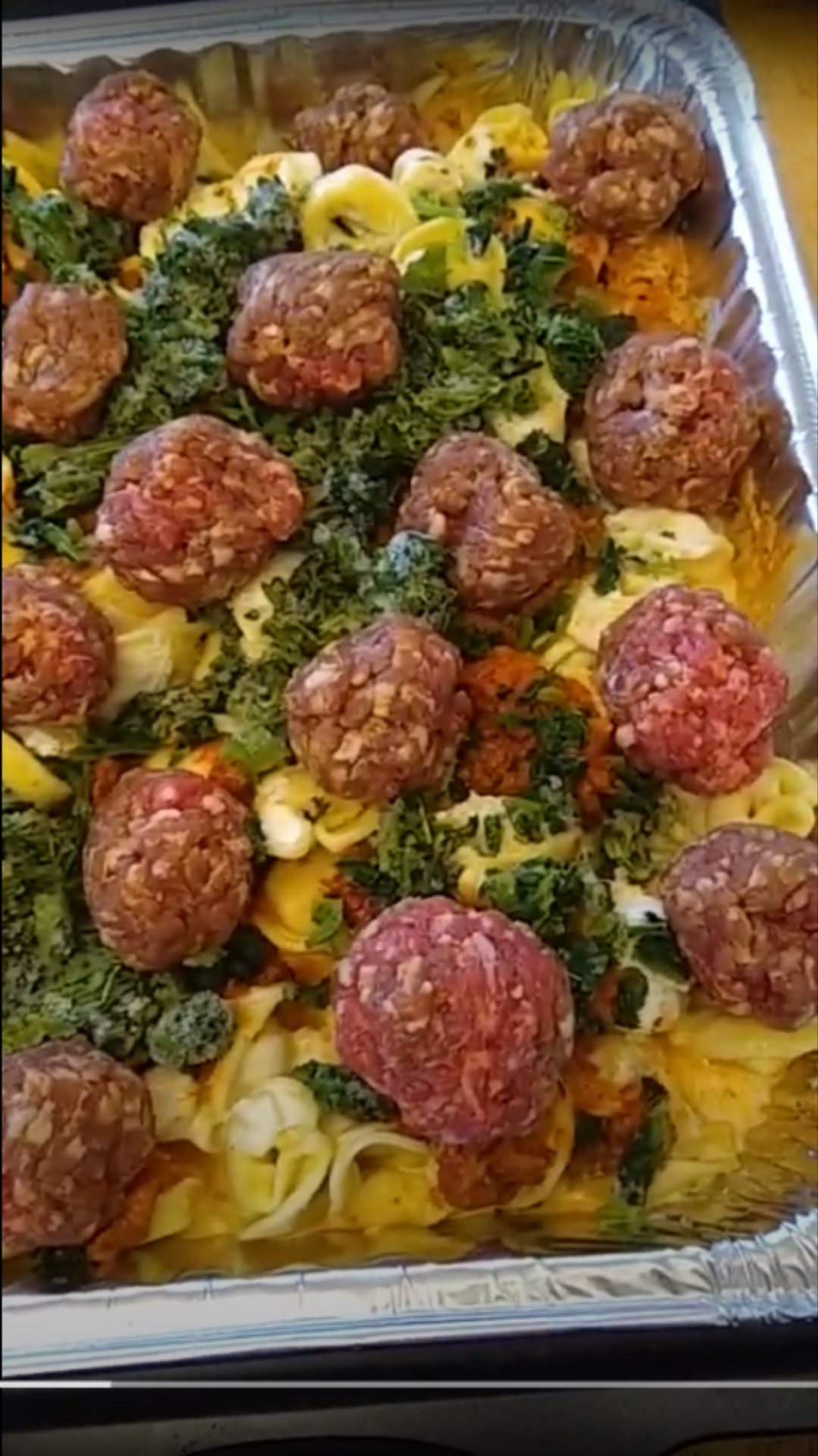uncooked raw sausage in frozen tortellini bake