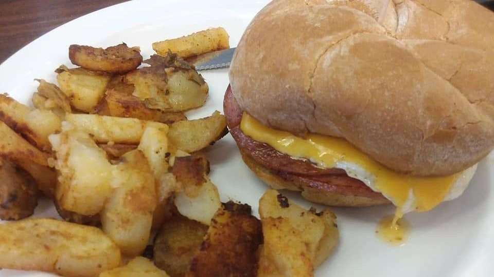taylor ham egg and cheese on a kaiser roll with hashbrown potatoes at flapjacks cafe in venice florida