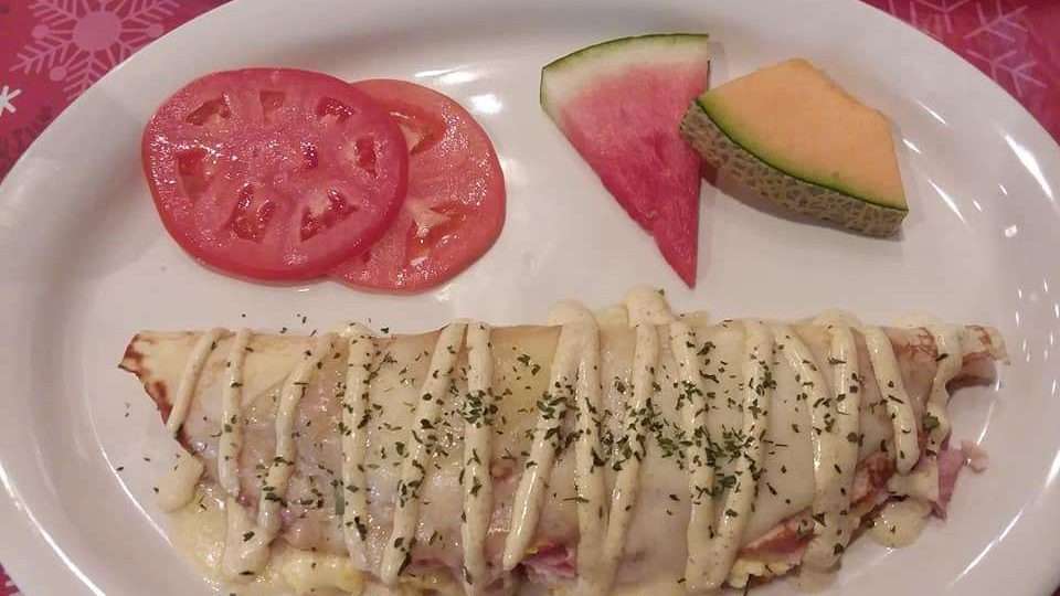 Le Crepe Delacroix… ham, eggs and melted swiss cheese inside a perfectly made crepe drizzled in a champagne mustard sauce that quite honestly was the most delicious part of the whole plate.
