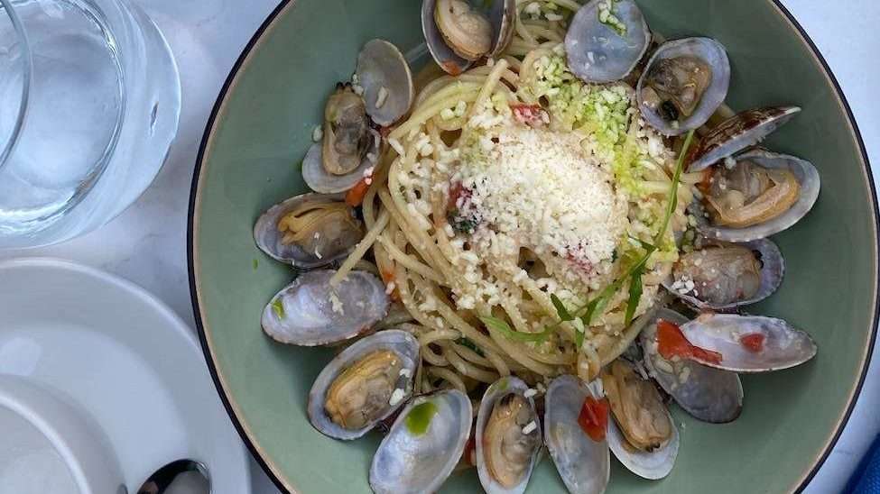 seafood pasta dishes on white ceramic plate