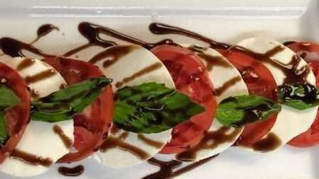 Trattoria Da Mino offers a timeless taste of Italy with their Caprese Classica