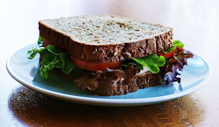 Delicious and nutritious homemade sandwich with whole wheat bread and fresh vegetables.