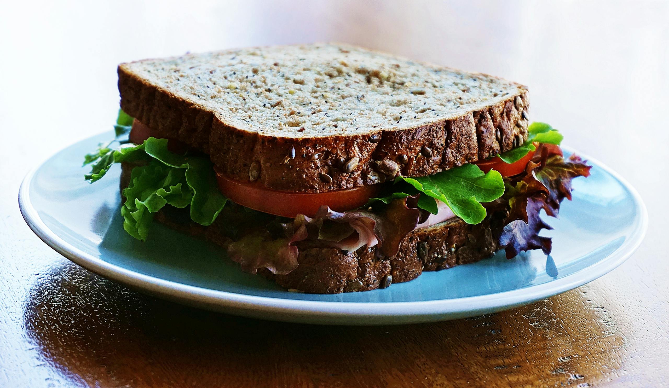 Delicious and nutritious homemade sandwich with whole wheat bread and fresh vegetables.